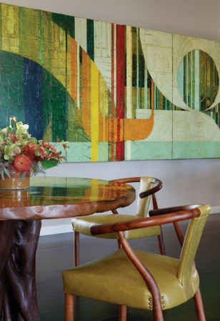 Colorful abstract art and warm woods enhance this space 