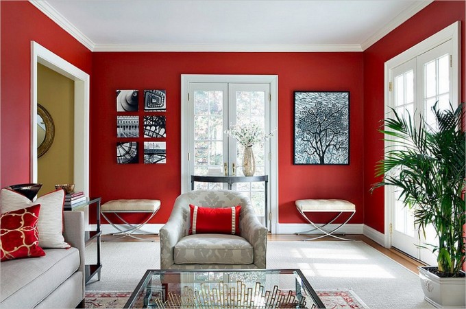 A modern living room with red walls.