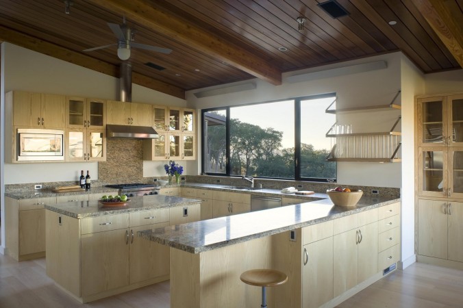 A wooden ceiling in a kitchen with minimalist interior design.