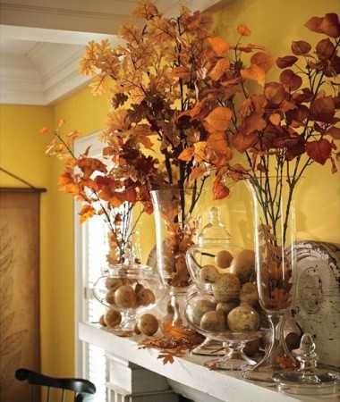 Branches of fall foliage create a lovely mantel display