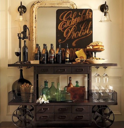 A versatile bar cart adorned with an array of bottles and glasses, making it a household champion.