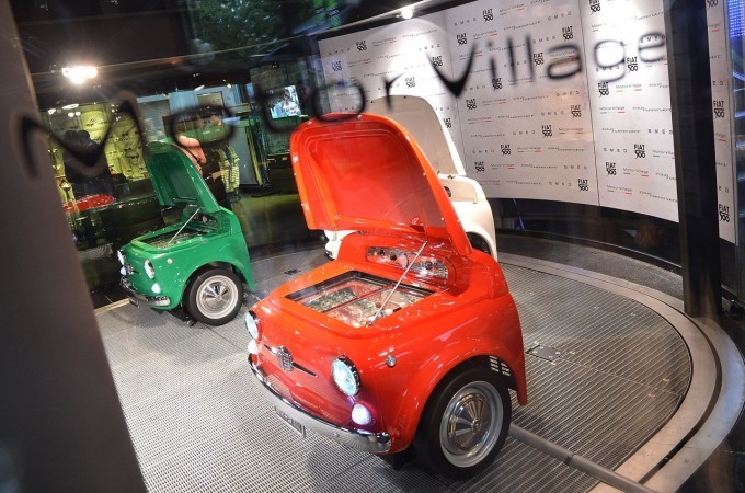 A car is on display in a museum.