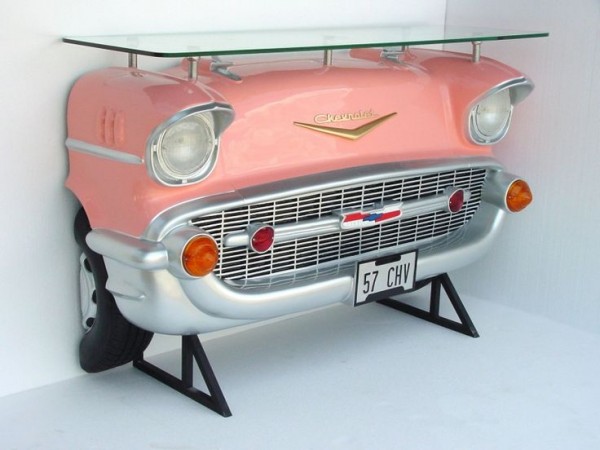 A pink chevrolet bar table with a glass top for sale.