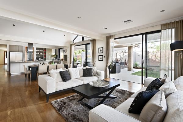 A living room with sliding glass doors and an open floor plan.