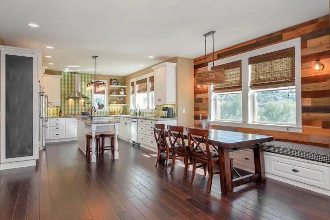 A kitchen with hardwood floors and an open floor plan.