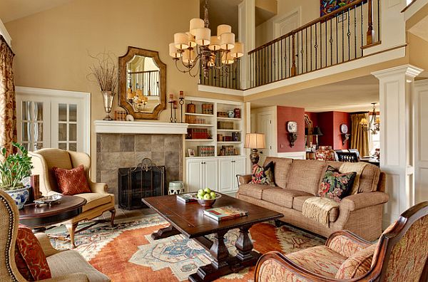 A living room with autumn-inspired furniture and an ornate fireplace.