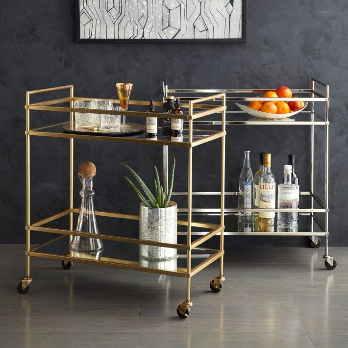 Keywords: bar cart, household champion

Description: A versatile household champion, the bar cart combines elements of gold and glass to create an elegant and functional addition in any space.
