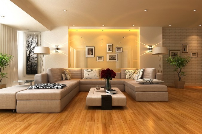 A living room with beige walls and low-profile wooden floors.