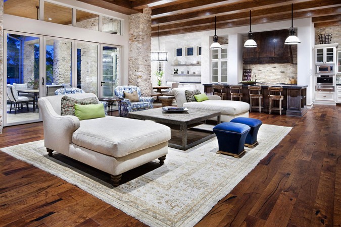 Wood beams and floors reflect a rustic style in this modern home