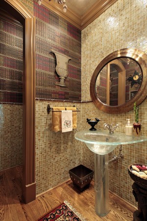 Powder room in luxury home with glass sink 