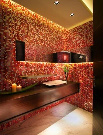 A red tiled powder room with panache.