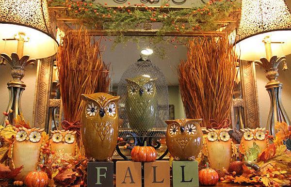 A mantle with fall decorations featuring owls, perfect for your home this fall.