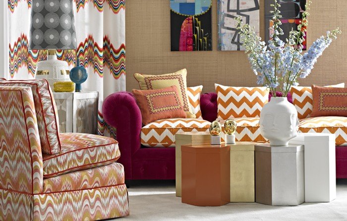 A living room with colorful chevron patterned furniture by Alexa Hampton.