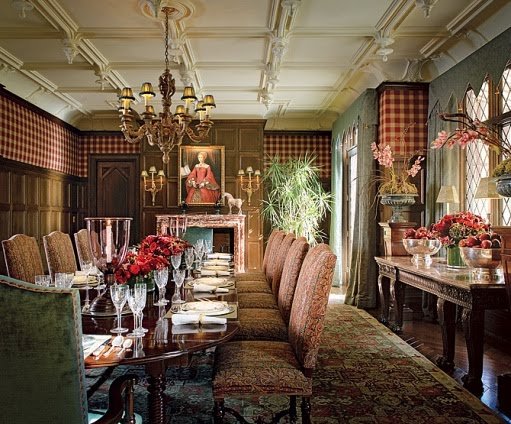 An ornate dining room with a large table and chairs, designed by Alexa Hampton.