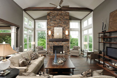 Wood beams and a stone fireplace create visual interest 