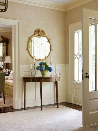 An entryway with a mirror.
