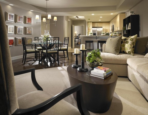 A living room with a table and chairs, perfect for enjoying an open floor plan.