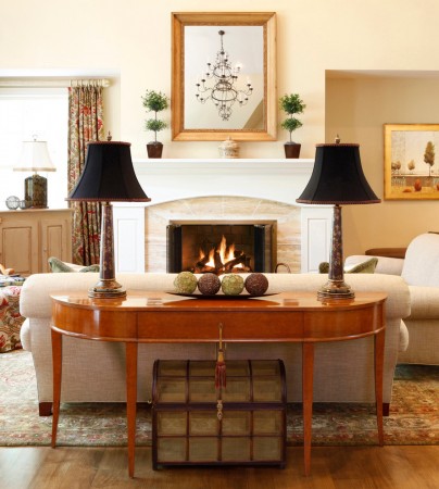 A stylish living room featuring a fireplace and the versatile Demilune Table.