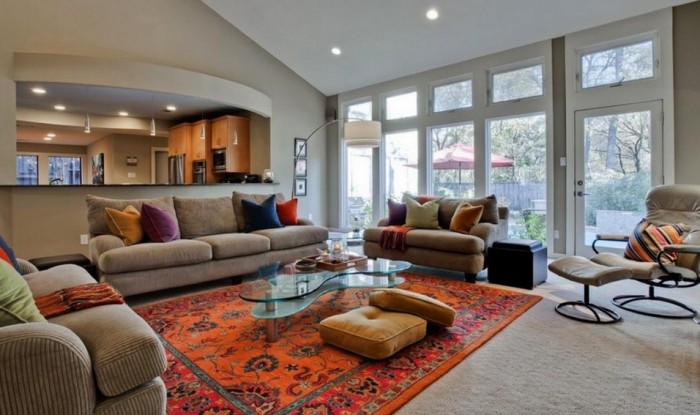 A living room with cozy couches and a coffee table, perfect for fall.