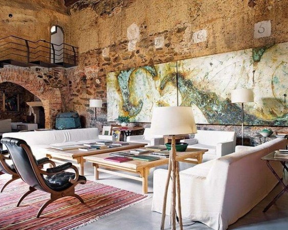Rustic stone walls enhance this modern rustic room 