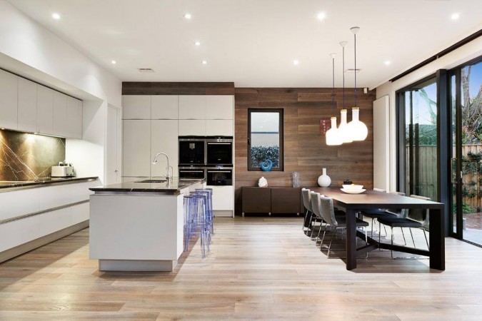 How to Enjoy the Modern Open Floor Plan with a Dining Table and Wood Floors.