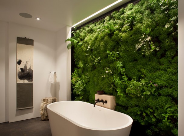 A garden-themed bathroom with a moss wall.