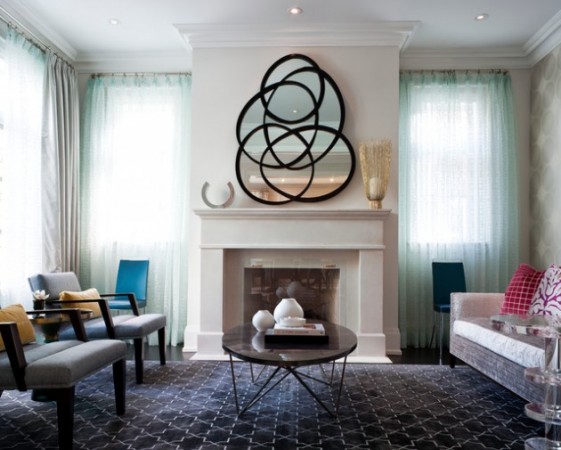 a mirror above the fireplace can give an unique touch of elegance and creativity to the living room