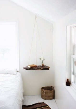 A white bedroom with nightstands.