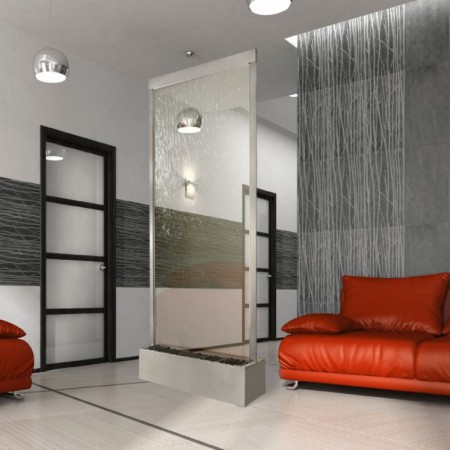 A modern living room with water walls and a glass shower.