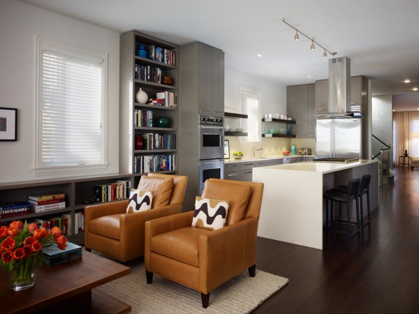 Keywords: Leather chairs, bookshelves
Modified description: A living room furnished with stylish leather chairs and bookshelves.