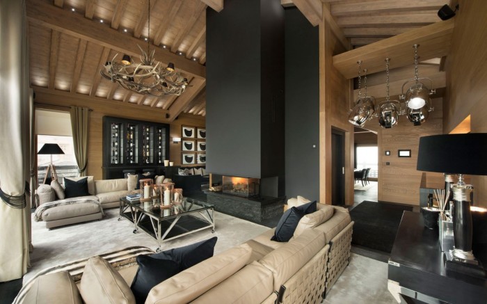 A uniquely designed living room showcasing a fireplace and wooden walls, demonstrating interior design as an art form.