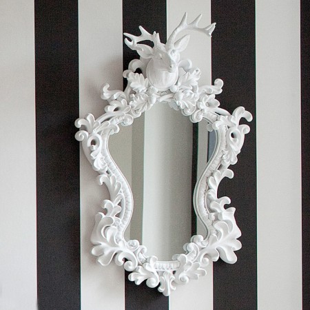 classy and elegant mirror with a baroque frame