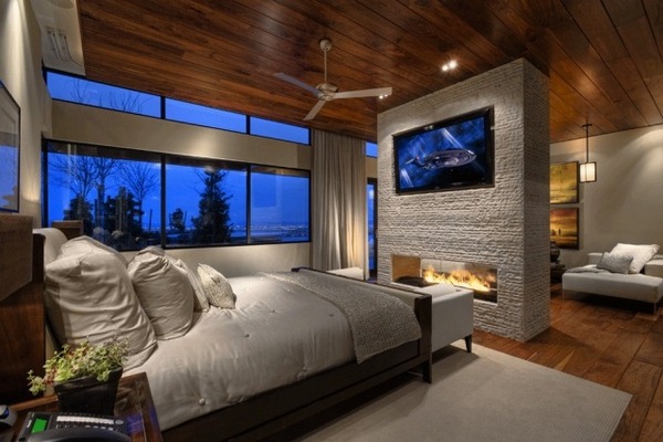 Gorgeous bedroom designed with two-sided fireplace