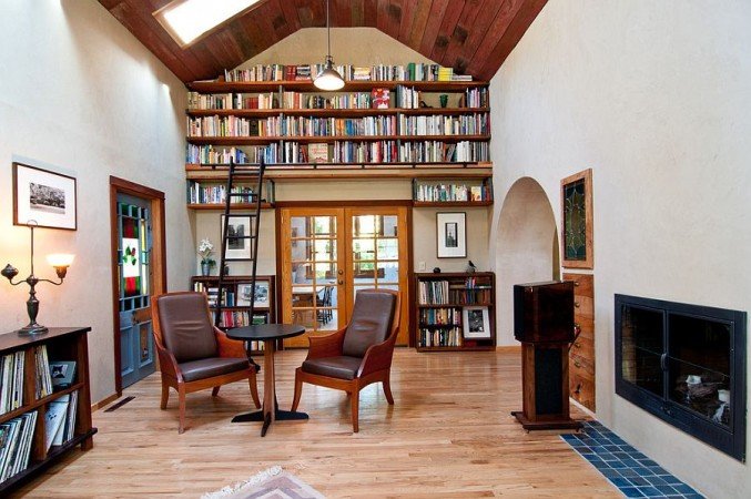 A living room with bookshelves showcasing vertical interior design.