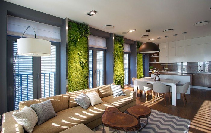 A moss wall adds a touch of vertical interior design to this living room.