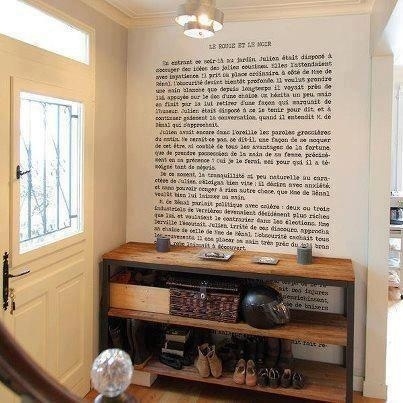 A attention grabbing hallway with a book on the wall.