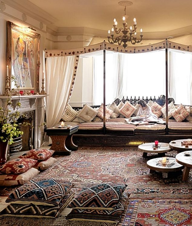 Styling an ornate living room with rugs and pillows in a gorgeous Moroccan theme.