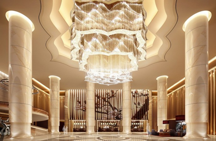 The lobby of a luxury hotel with a large chandelier showcases interior design.