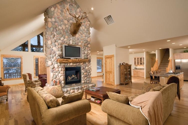 Mountain lodge-inspired two-sided fireplace