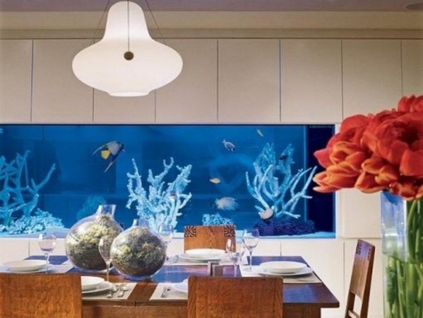 A dining room with an aquarium centerpiece.
