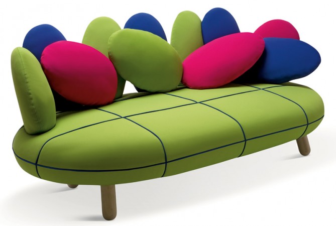 A fun and unique sofa adorned with colorful pillows.