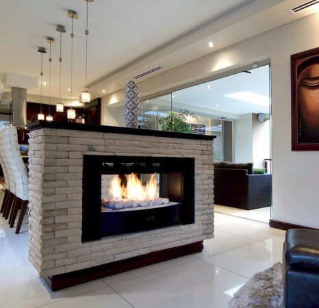 Home styled with free-standing two-sided fireplace