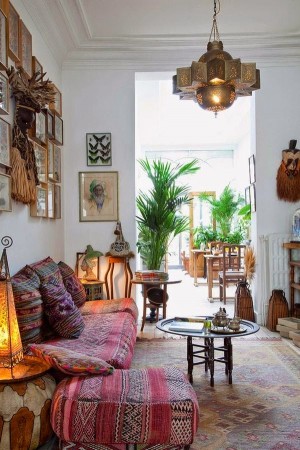 Styling a Moroccan living room with a colorful rug and a lamp.