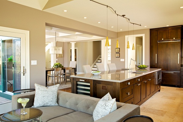 A modern open kitchen with a dining table and chairs.