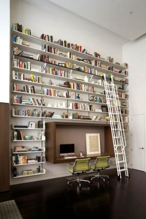 A private room with beautiful bookshelves and a desk.
