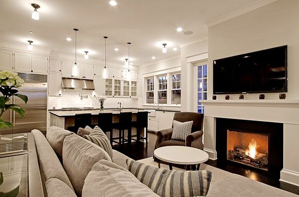 An open living room with a fireplace and tv.