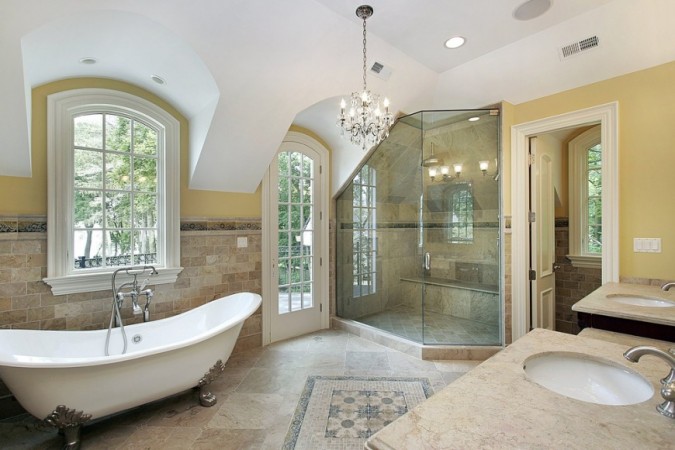 A large bathroom with a bathtub and elegance.