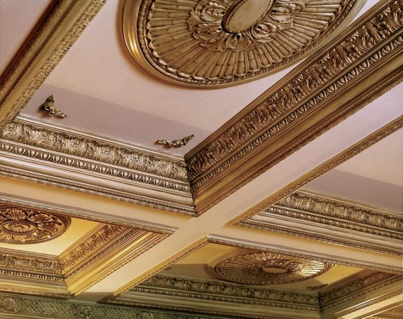 Gilded embellishments highlight this coffered ceiling