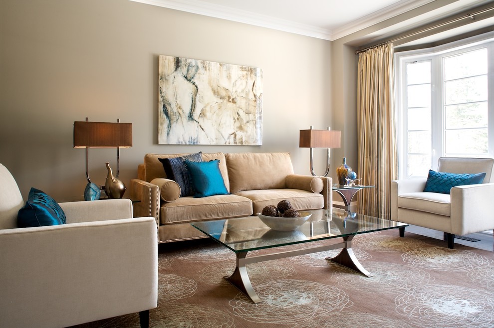 Living room with beige furniture and blue accents featuring an elegant color scheme for an earthy vibe.