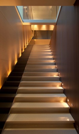 A staircase with lights in a modern house.